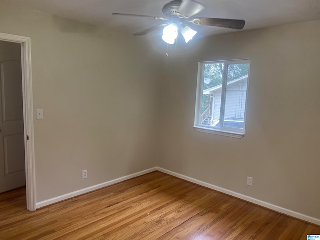 unfurnished room featuring ceiling fan and light wood-type flooring