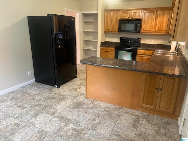 kitchen featuring sink, kitchen peninsula, and black appliances