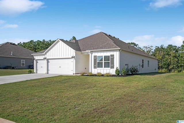 view of front of house with a front yard and a garage