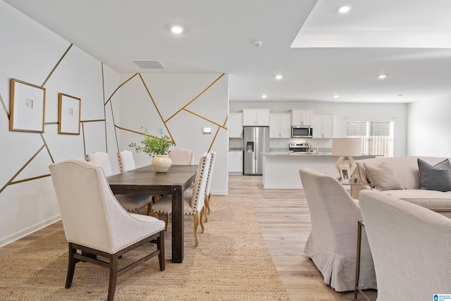 dining room with light hardwood / wood-style floors