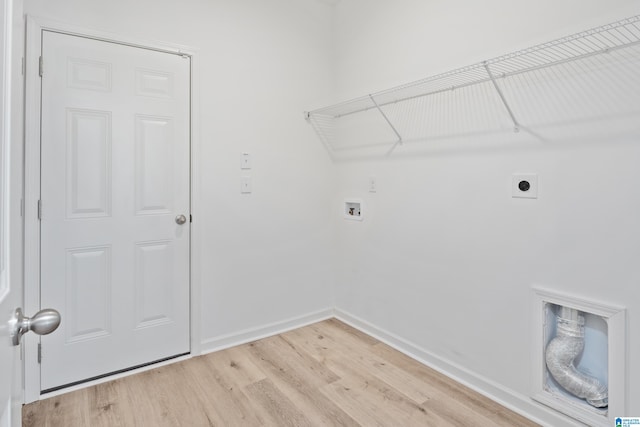 laundry room featuring washer hookup, light hardwood / wood-style floors, and electric dryer hookup