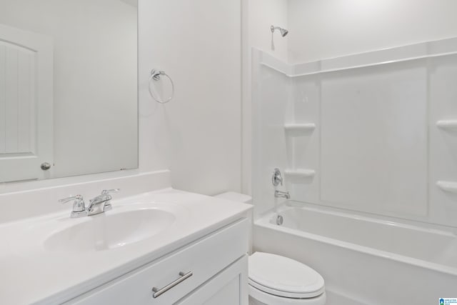 full bathroom featuring bathing tub / shower combination, vanity, and toilet