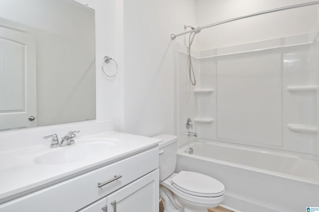 full bathroom with bathing tub / shower combination, vanity, and toilet