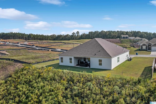 birds eye view of property with a rural view