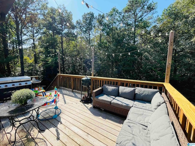 wooden deck featuring outdoor lounge area