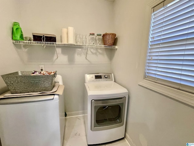 laundry room with washing machine and clothes dryer