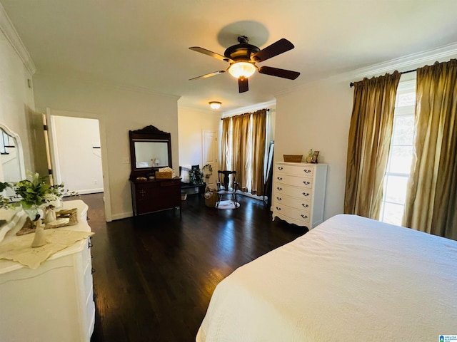 bedroom featuring dark hardwood / wood-style floors, crown molding, and ceiling fan