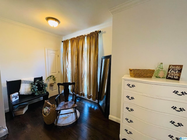 living area with dark wood-type flooring and ornamental molding