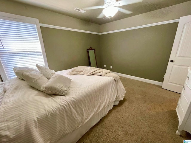 bedroom with ceiling fan and carpet flooring