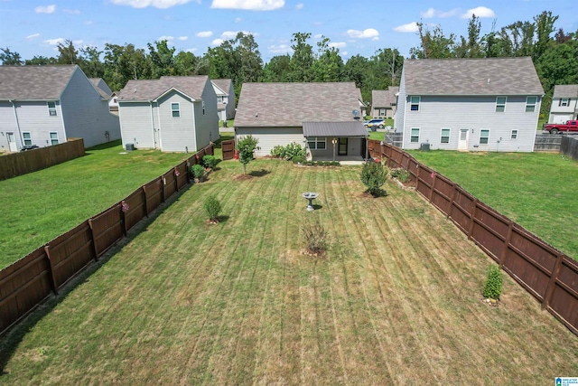 rear view of house with a lawn