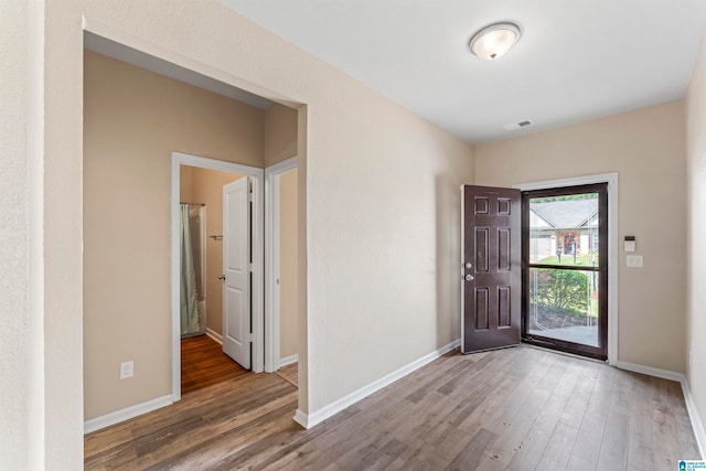 foyer entrance with wood-type flooring