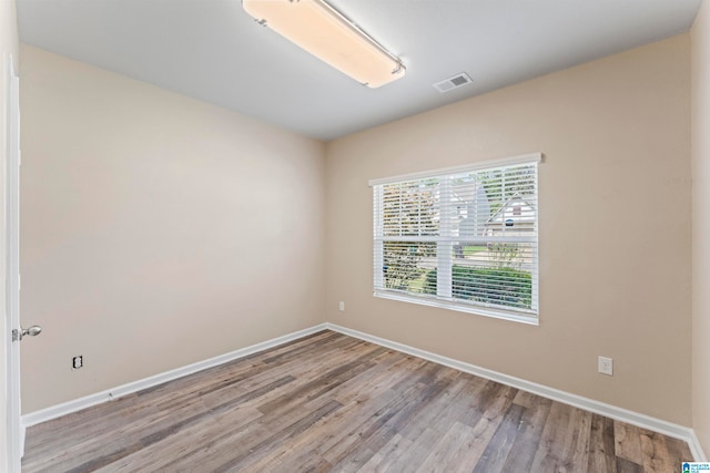 spare room with light hardwood / wood-style flooring