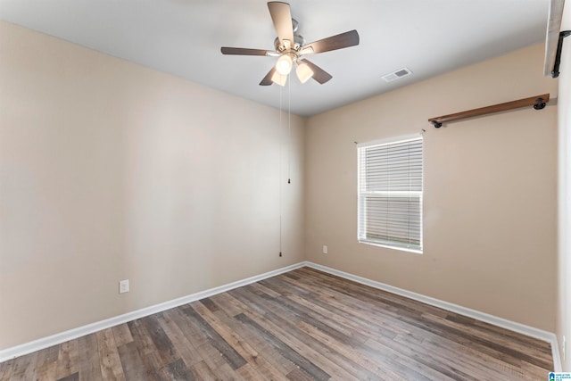 unfurnished room with ceiling fan and hardwood / wood-style flooring