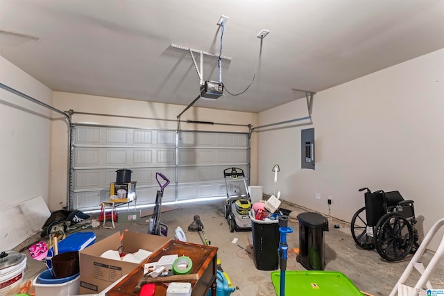 garage featuring a garage door opener and electric panel