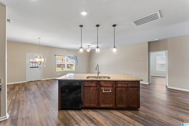 kitchen with dark hardwood / wood-style floors, black dishwasher, sink, and an island with sink