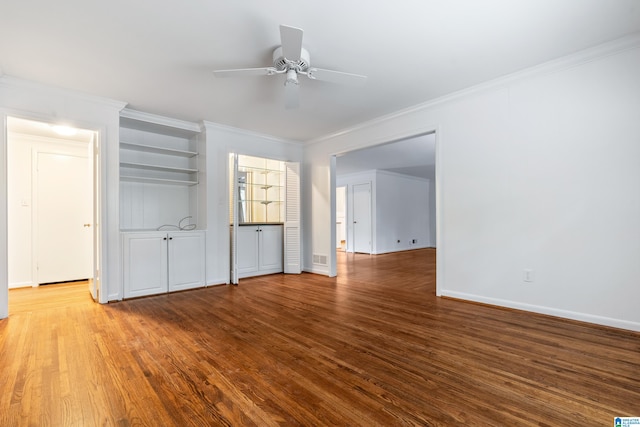 unfurnished living room featuring ceiling fan, crown molding, and hardwood / wood-style floors