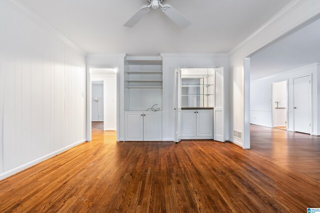 unfurnished living room with ceiling fan, ornamental molding, and wood-type flooring