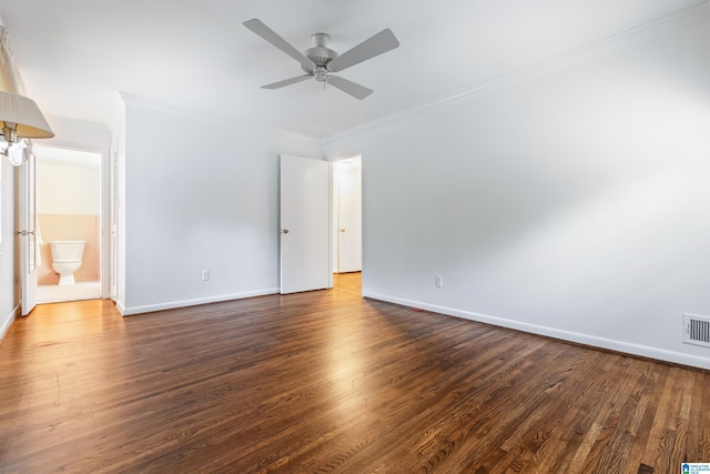 unfurnished room with ceiling fan, crown molding, and dark wood-type flooring