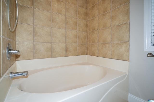 bathroom featuring a tub to relax in