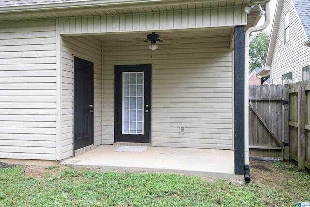 view of exterior entry featuring ceiling fan