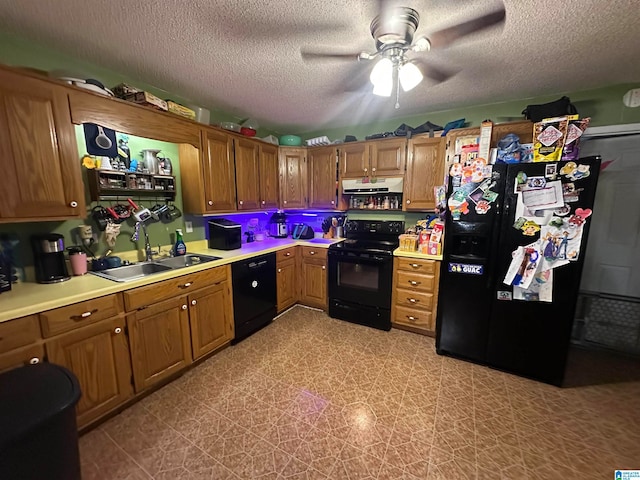 kitchen with ceiling fan, a textured ceiling, sink, and black appliances