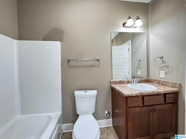 bathroom with tile patterned floors, vanity, and toilet