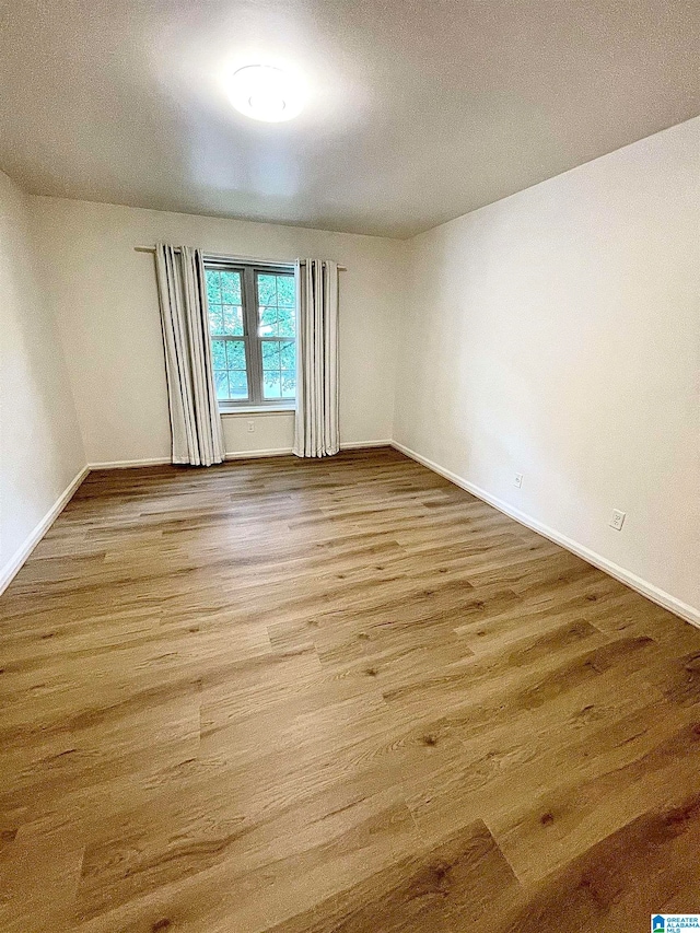 spare room with light hardwood / wood-style floors