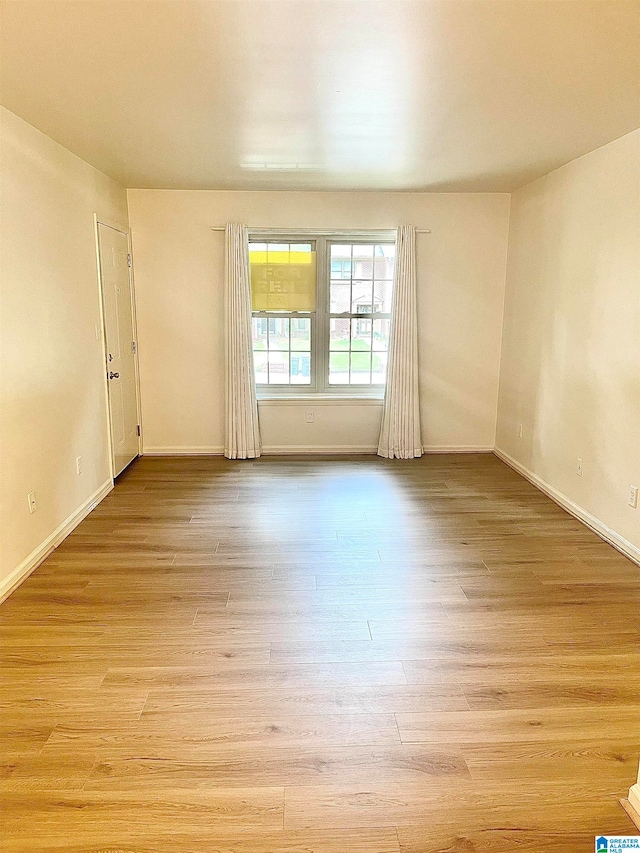 unfurnished room featuring light hardwood / wood-style flooring