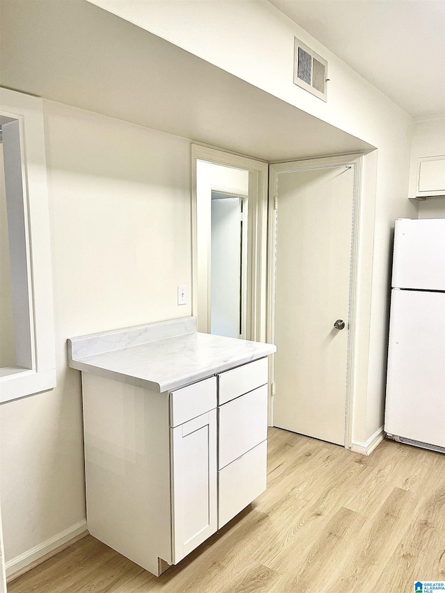 2139 Montreat Dr Unit C, Vestavia Hills, AL 35216 - kitchen featuring freestanding refrigerator, light wood-style floors, white cabinets, and light countertops