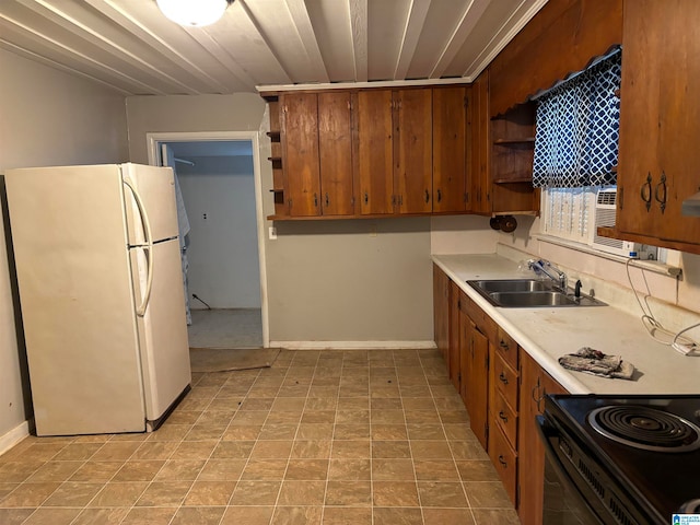 kitchen featuring white refrigerator and sink