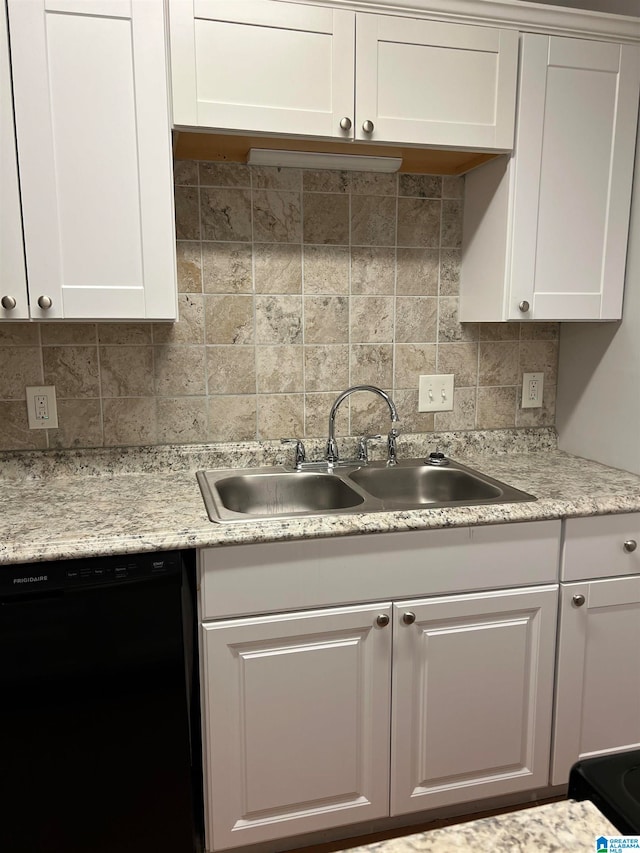 kitchen featuring sink, tasteful backsplash, dishwasher, and white cabinets