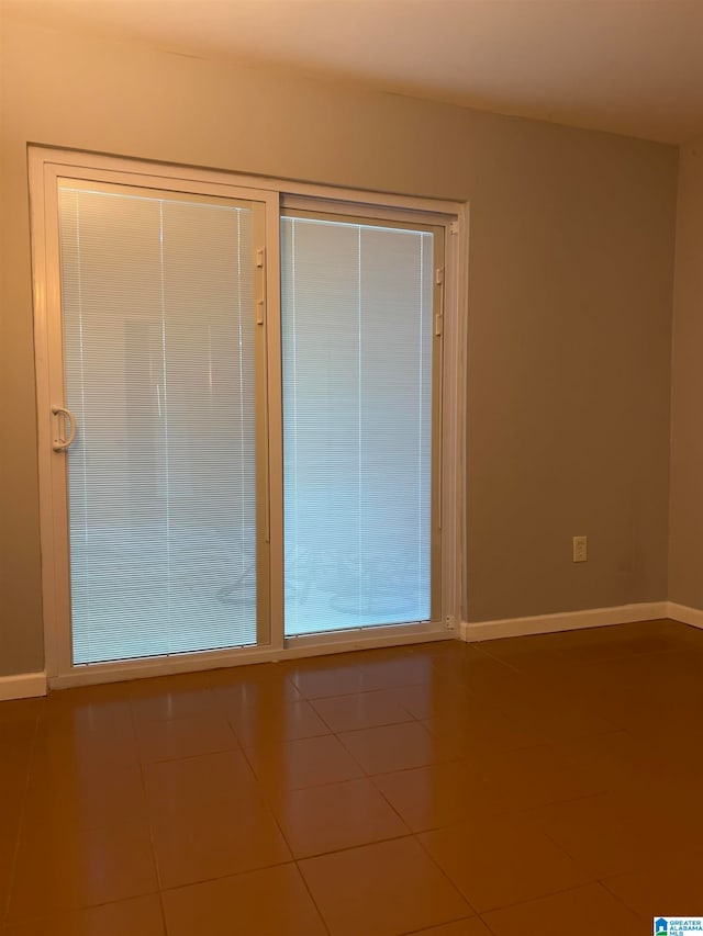 empty room with tile patterned floors