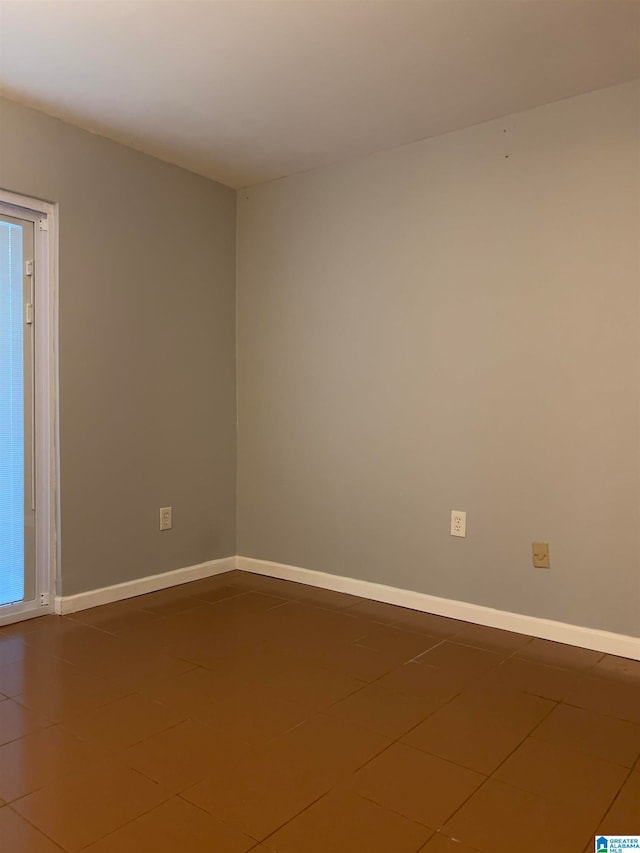 view of tiled spare room