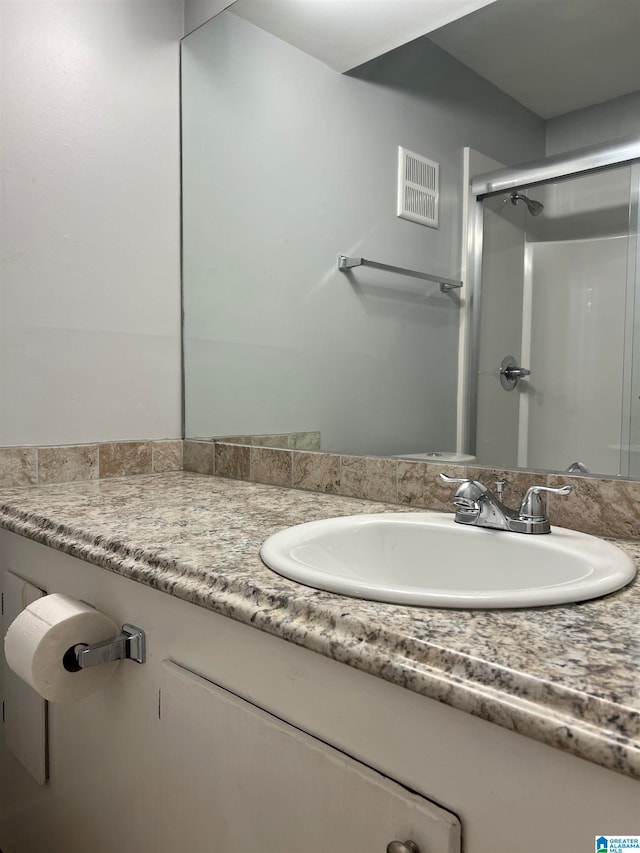 bathroom featuring vanity and walk in shower