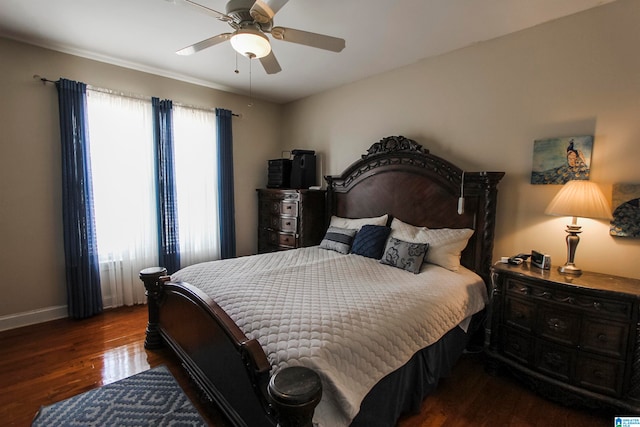 bedroom featuring ceiling fan and dark hardwood / wood-style floors