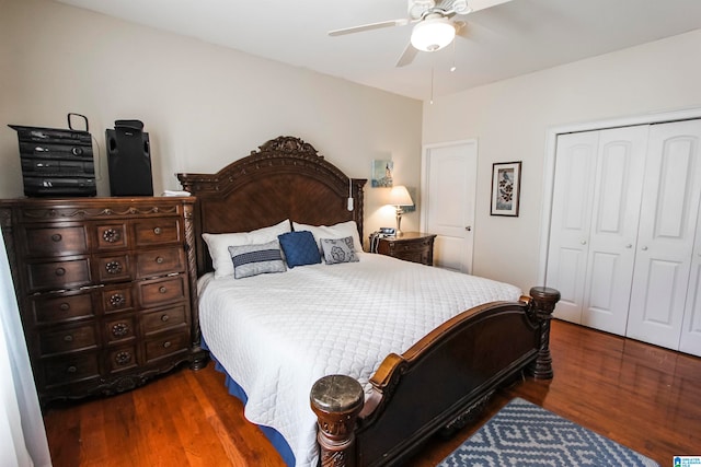 bedroom featuring dark wood-type flooring, a closet, and ceiling fan