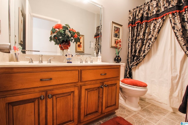 bathroom with vanity, toilet, and tile patterned floors