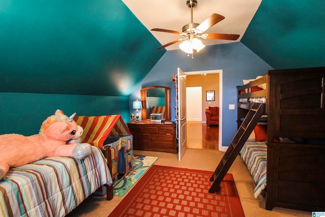 bedroom with light carpet, vaulted ceiling, and ceiling fan