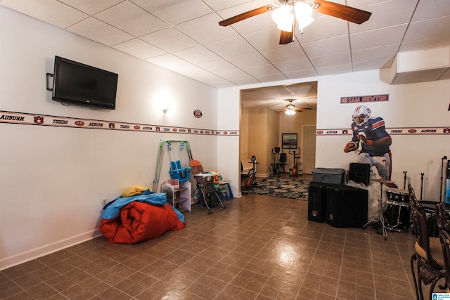 interior space with ceiling fan