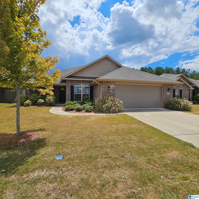 view of front of house with a front yard and a garage