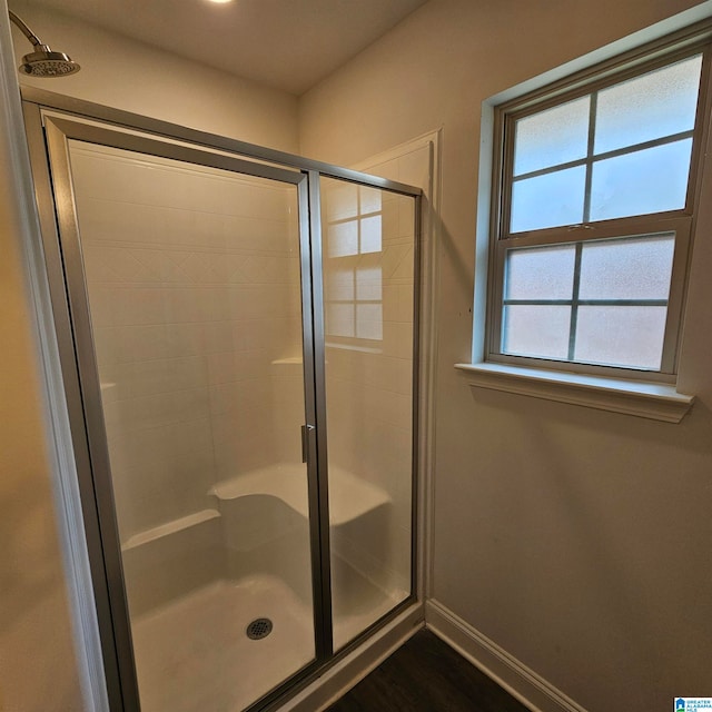 bathroom with a shower with shower door