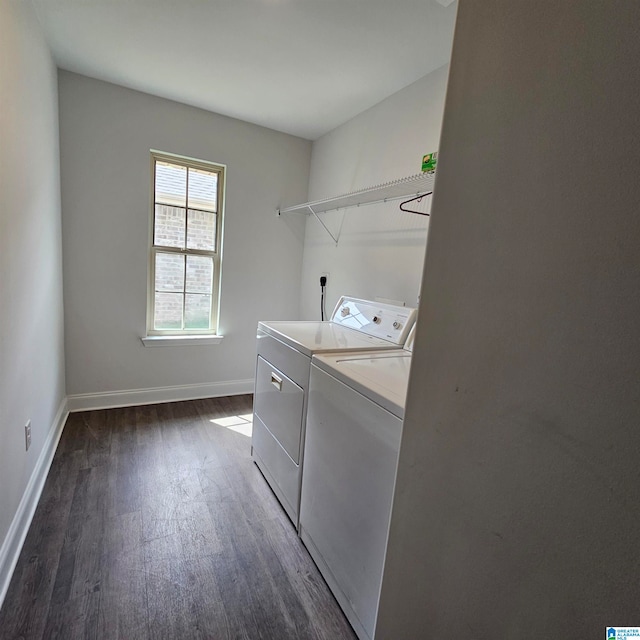 clothes washing area featuring washer and dryer and dark wood-type flooring