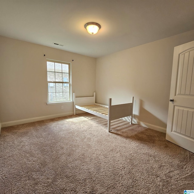 unfurnished bedroom featuring carpet flooring