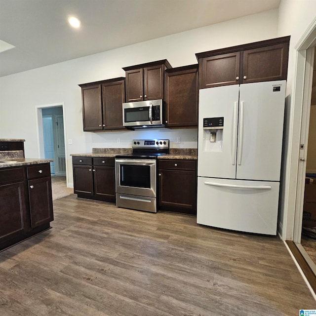 kitchen featuring dark brown cabinets, dark hardwood / wood-style floors, and stainless steel appliances