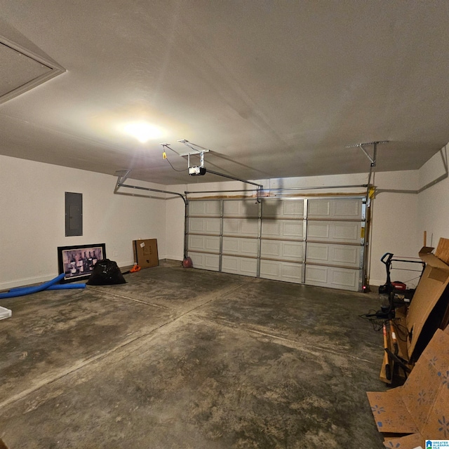 garage featuring a garage door opener and electric panel