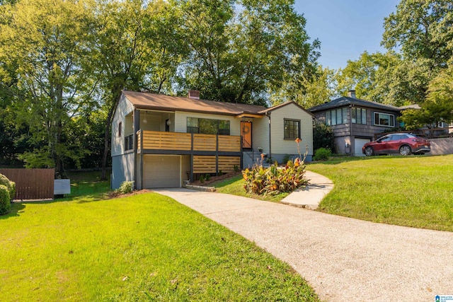 view of front of property with a garage and a front yard