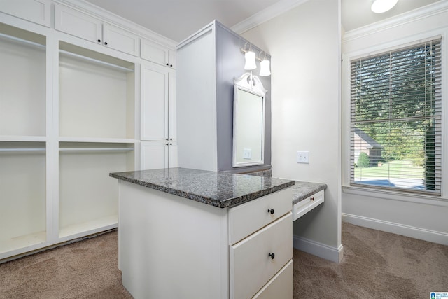 walk in closet featuring carpet and built in desk