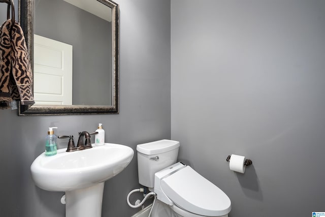 bathroom with sink and toilet