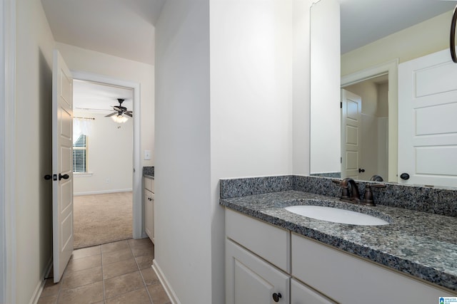 bathroom with tile patterned floors, ceiling fan, and vanity