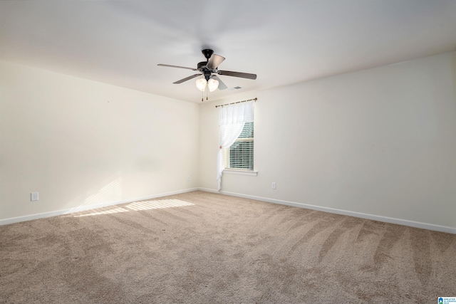 spare room with carpet flooring and ceiling fan